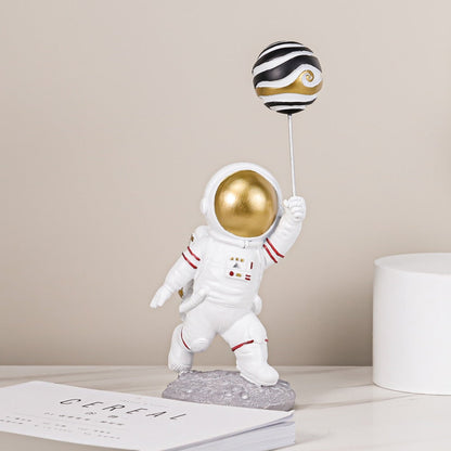 Astronaut with Planet Balloon