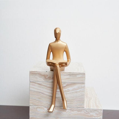 Golden Geometric Sitting Statue