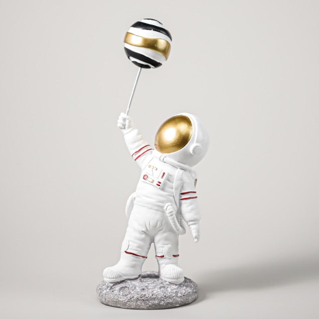 Astronaut with Planet Balloon