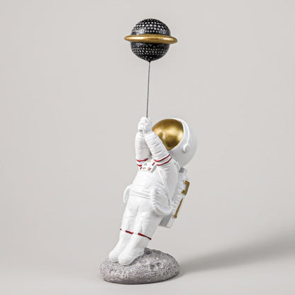 Astronaut with Planet Balloon